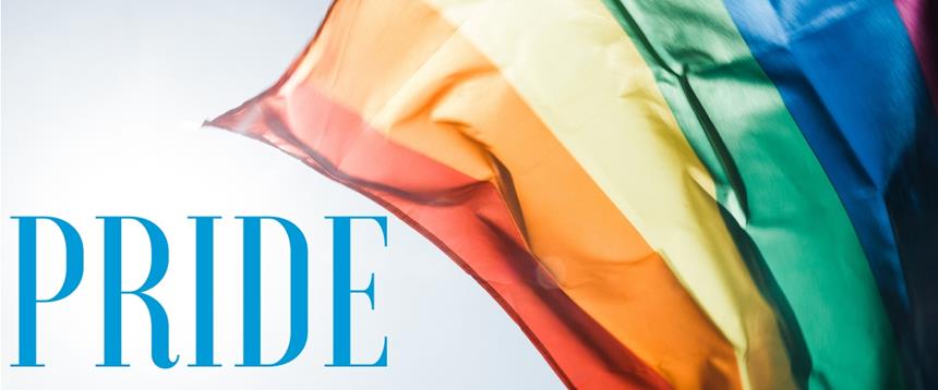 Photo of rainbow flag with text: Pride