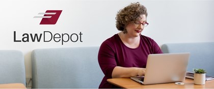 Woman sitting at table using a laptop. LawDepot logo in corner